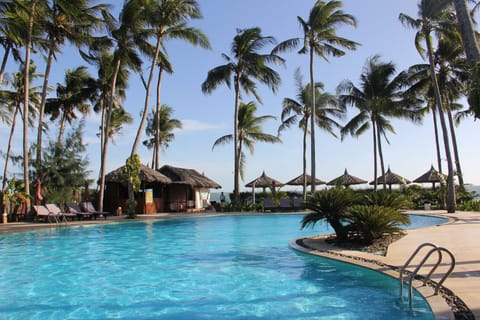 Outdoor pool, a waterfall pool, pool umbrellas, sun loungers