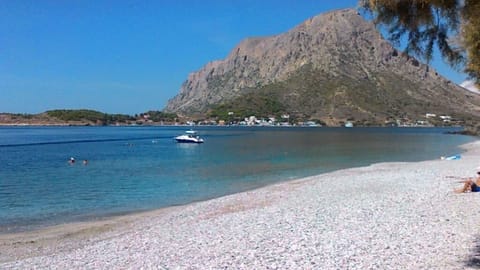 On the beach, white sand, beach cabanas, sun loungers