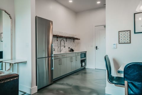 Studio, 1 King Bed | Private kitchen | Full-size fridge, microwave, coffee/tea maker, toaster