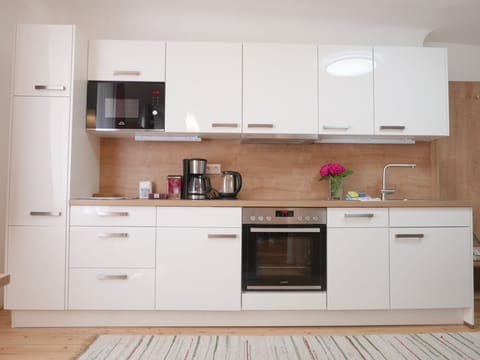 Comfort Condo | Private kitchen | Full-size fridge, microwave, oven, stovetop