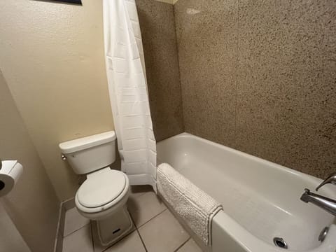 Standard Double Room, 1 Queen Bed | Bathroom | Combined shower/tub, hair dryer, towels, soap