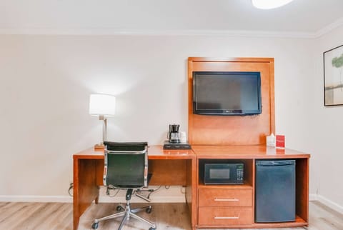 Premium bedding, desk, laptop workspace, blackout drapes