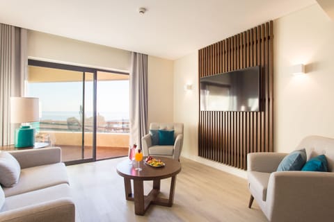 Premium Suite, 2 Bedrooms, Balcony, Pool View | Living area | 49-inch flat-screen TV with cable channels, TV