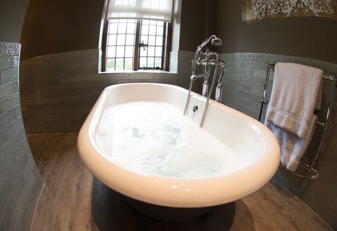 Luxury Suite, Garden View | Bathroom | Free toiletries, hair dryer, heated floors, towels