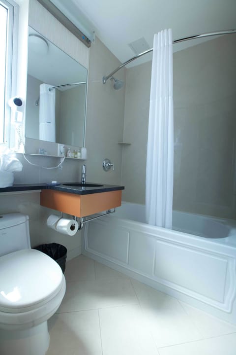 Standard Room, 1 King Bed, City View | Bathroom | Combined shower/tub, deep soaking tub, rainfall showerhead