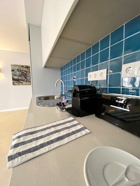 Deluxe Condo | Private kitchenette | Fridge, microwave, stovetop, coffee/tea maker