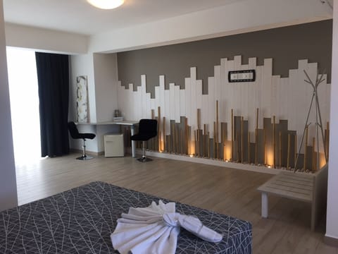 Deluxe Double Room | Minibar, in-room safe, desk, blackout drapes