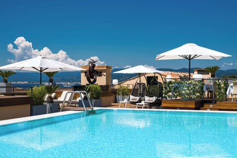 Outdoor pool, open 8:00 AM to 7:00 PM, pool umbrellas, sun loungers