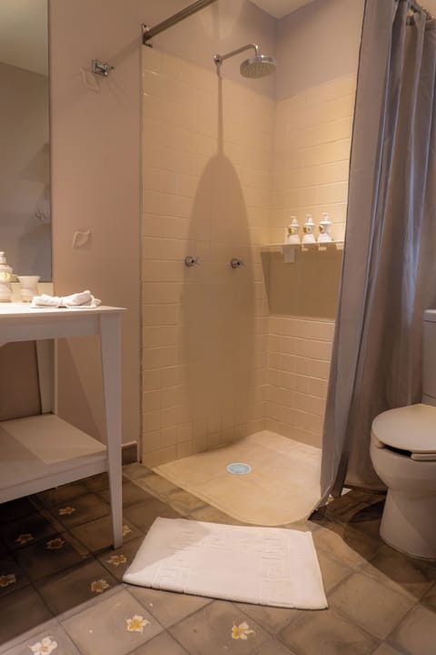 Superior King | Bathroom | Shower, free toiletries, towels, soap