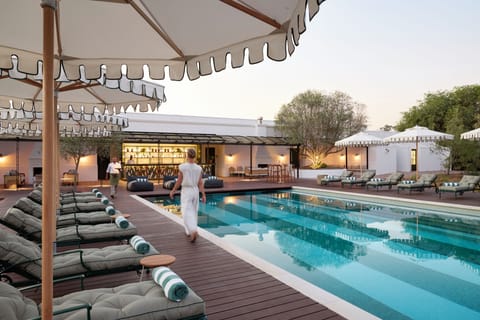 Outdoor pool, pool umbrellas, sun loungers