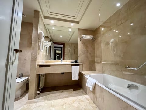 Combined shower/tub, deep soaking tub, hair dryer, bidet