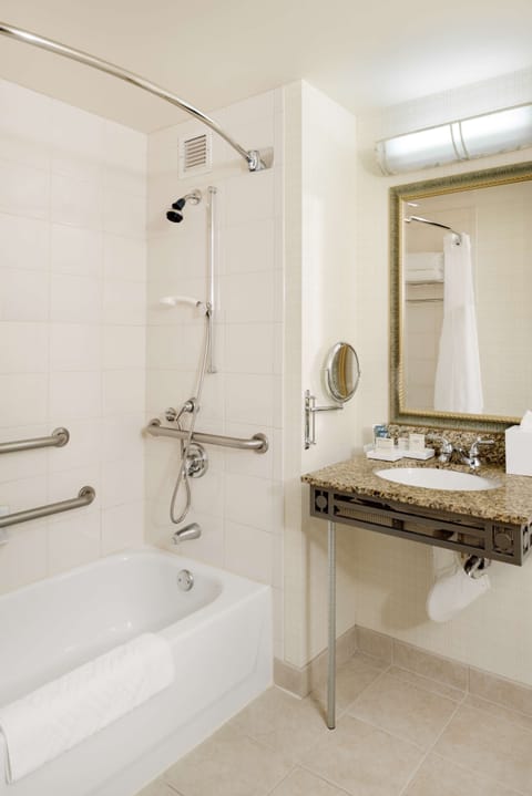 Combined shower/tub, designer toiletries, hair dryer, towels