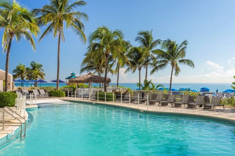 Outdoor pool, pool umbrellas, sun loungers