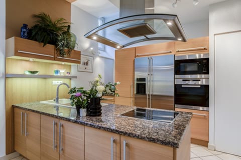 Panoramic Apartment | Private kitchen | Coffee/tea maker, electric kettle, dining tables