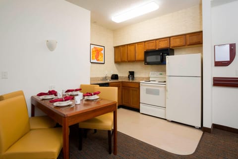 Suite, 2 Bedrooms | Private kitchen | Full-size fridge, microwave, stovetop, coffee/tea maker