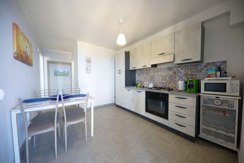 Basic Apartment, 2 Bedrooms, Sea View | Private kitchen | Electric kettle, highchair, coffee grinder, freezer