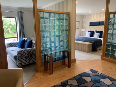 Deluxe Suite | Premium bedding, desk, blackout drapes, iron/ironing board