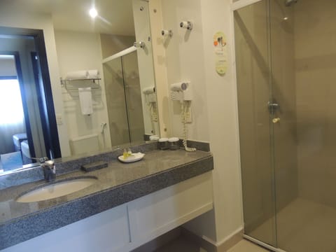 Executive Suite, 1 King Bed, Non Smoking | Bathroom | Shower, rainfall showerhead, free toiletries, towels