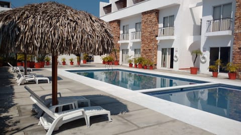 Outdoor pool, open 9:30 AM to 9:00 PM, sun loungers