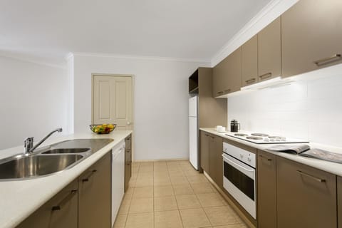 Three Bedroom Standard Apartment | Private kitchenette | Full-size fridge, microwave, oven, stovetop