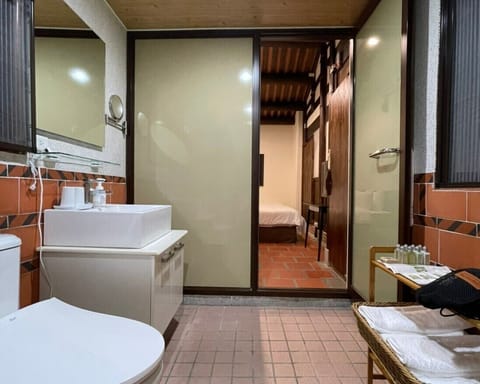 Tan | Bathroom | Shower, free toiletries, hair dryer, slippers