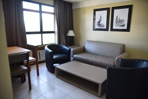 Executive Double Room | Living area | Flat-screen TV