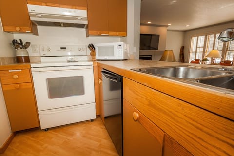 Condo, 2 Bedrooms | Private kitchen | Oven, cookware/dishes/utensils, dining tables