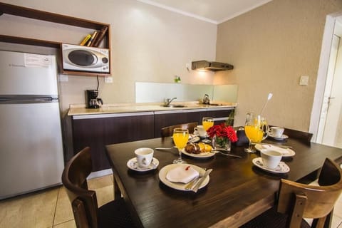 Deluxe Apartment | Private kitchen | Full-size fridge, microwave, stovetop, cookware/dishes/utensils