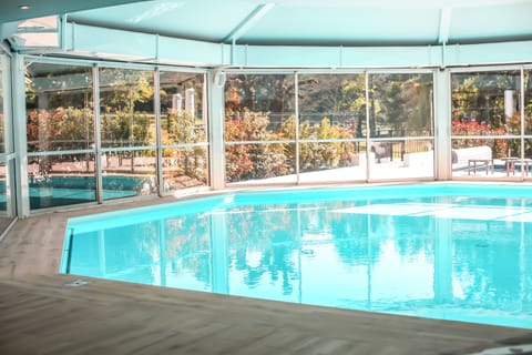 Indoor pool, outdoor pool, pool umbrellas, sun loungers