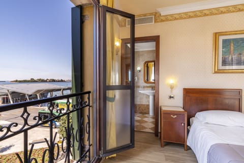 Classic Double Room (Partial Canal View) | Down comforters, minibar, in-room safe, individually decorated