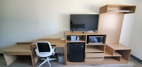 Desk, laptop workspace, blackout drapes, iron/ironing board