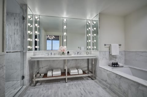 Shower, designer toiletries, hair dryer, bathrobes