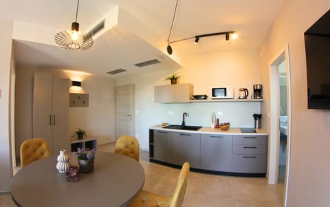 Family Room, Kitchenette | In-room safe, desk, free WiFi, bed sheets