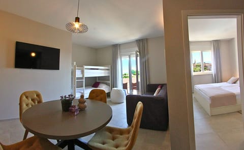 Family Room, Kitchenette | In-room safe, desk, free WiFi, bed sheets