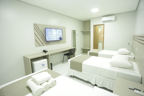 Standard Triple Room | Pillowtop beds, minibar, in-room safe, desk