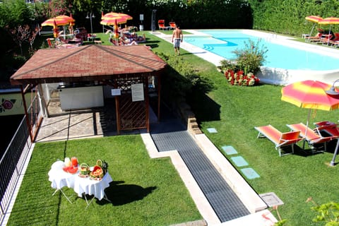 Seasonal outdoor pool, pool umbrellas, sun loungers