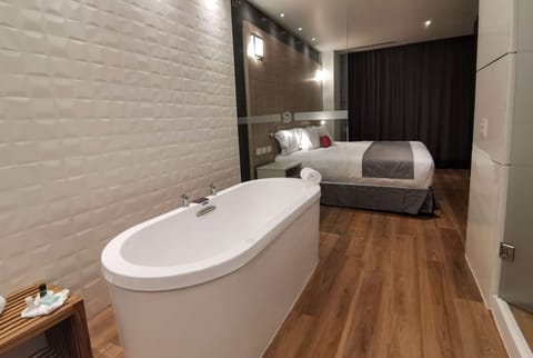 Suite, 1 King Bed, Non Smoking (Relax) | Bathroom | Shower, rainfall showerhead, hair dryer, heated floors