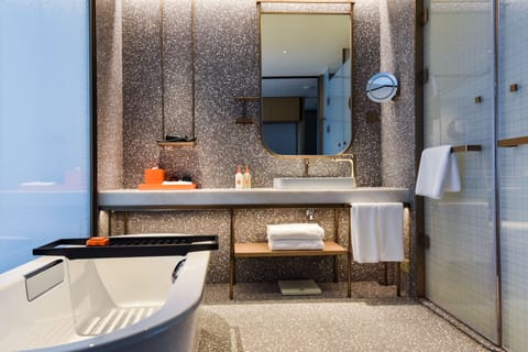 Separate tub and shower, rainfall showerhead, free toiletries