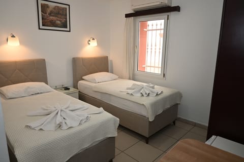 Standard Twin Room | In-room safe, blackout drapes, iron/ironing board, free WiFi