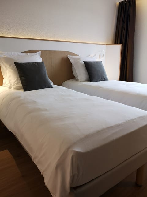 Premium bedding, pillowtop beds, blackout drapes, soundproofing