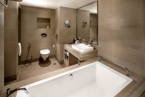 Suite, 1 King Bed | Bathroom | Shower, hydromassage showerhead, free toiletries, hair dryer