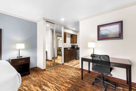 Premium bedding, desk, laptop workspace, iron/ironing board