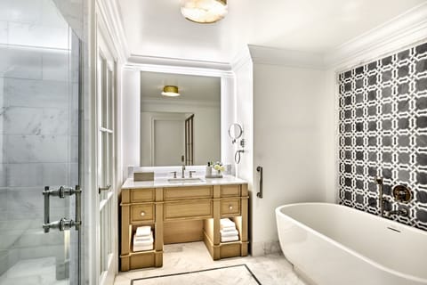 Separate tub and shower, designer toiletries, hair dryer, bathrobes