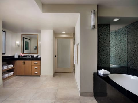 Suite, 1 King Bed | Bathroom | Combined shower/tub, designer toiletries, hair dryer, towels