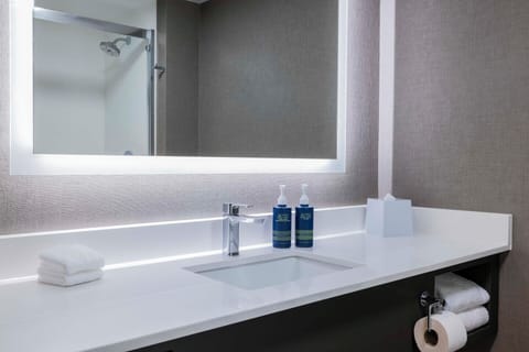 Shower, designer toiletries, hair dryer, towels