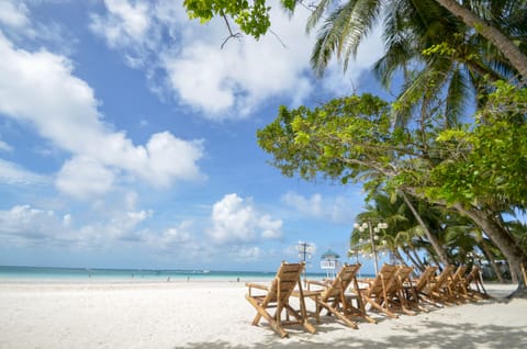 Beach nearby, white sand, sun loungers, beach umbrellas