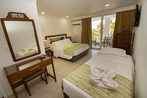 Family Room, Beach View | Minibar, in-room safe, iron/ironing board, bed sheets