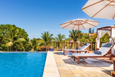 Outdoor pool, pool umbrellas, sun loungers