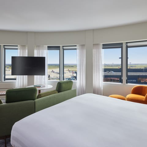 Spa Suite - Runway View | Premium bedding, minibar, in-room safe, blackout drapes