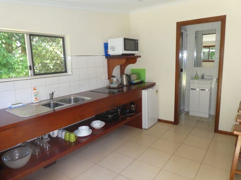 Superior Studio Suite, 1 Bedroom, Garden View | Private kitchen | Highchair